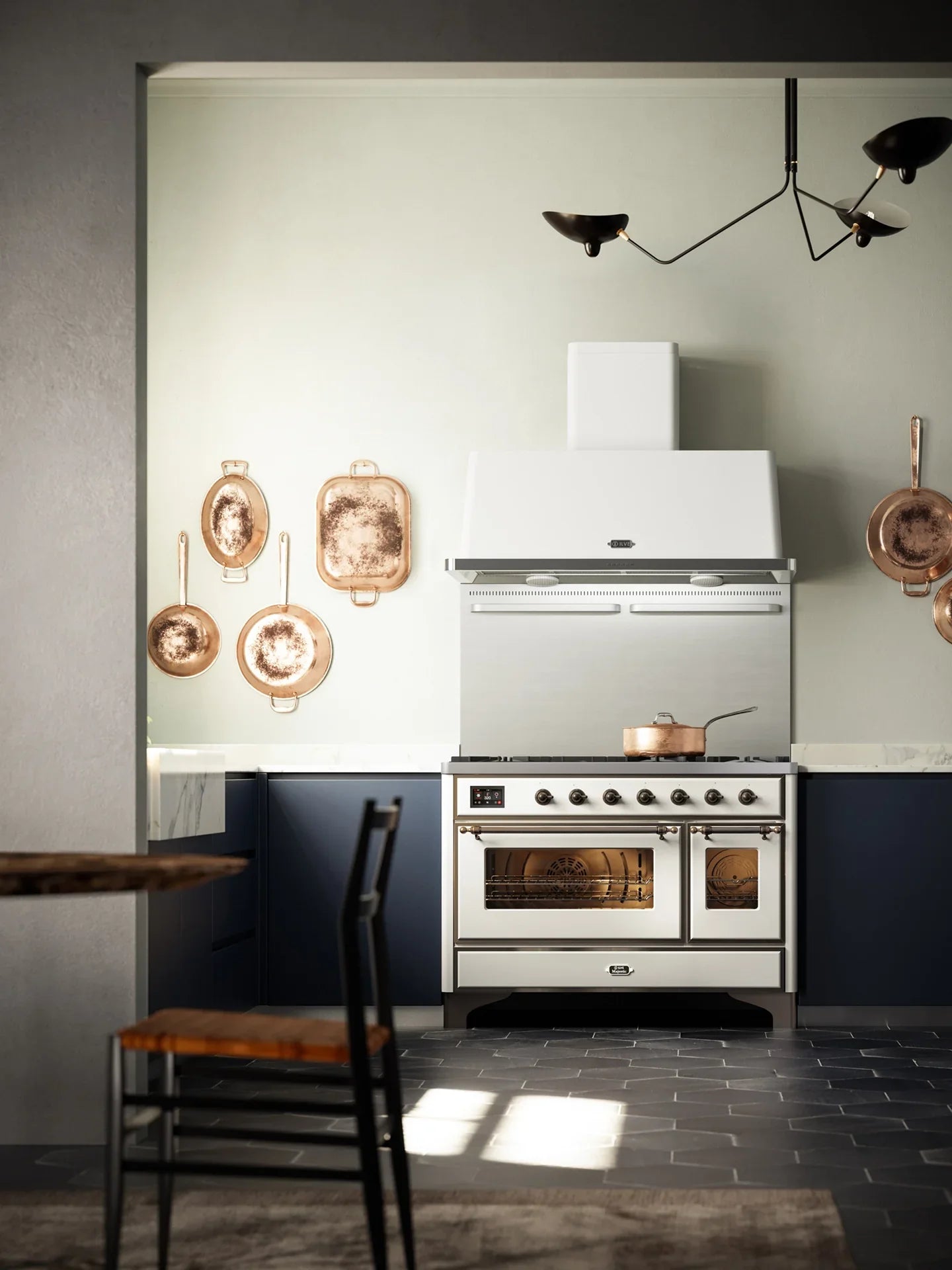 Falcon Glass Black Upright 1100mm Induction Cooker in modern kitchen with copper pans.