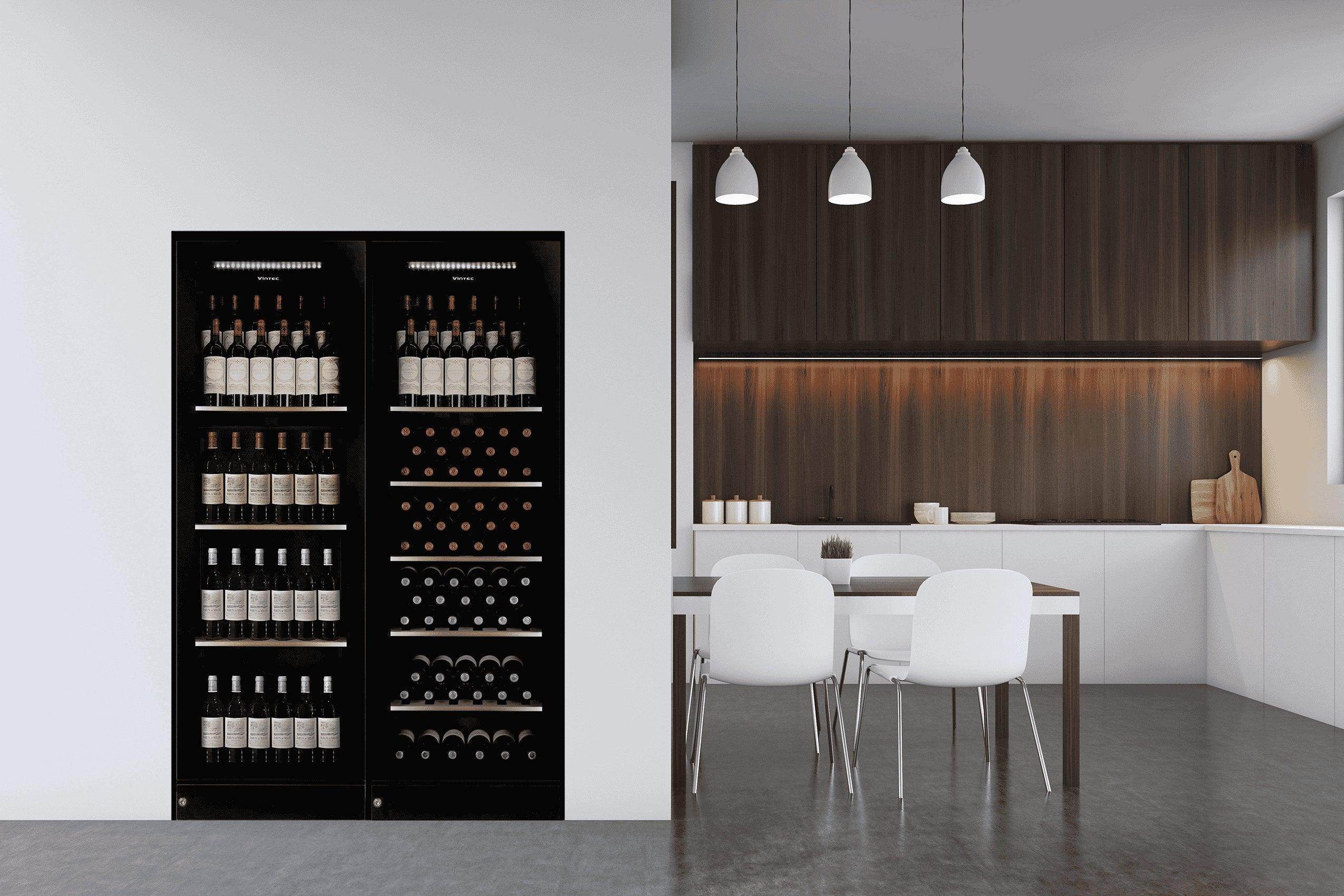 Modern kitchen with built-in black glass dual wine fridge, minimalist dining area, and wood accents.