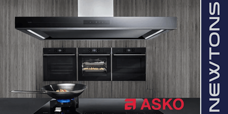 ASKO kitchen appliances: sleek black ovens, range hood, and cooktop in modern designer kitchen