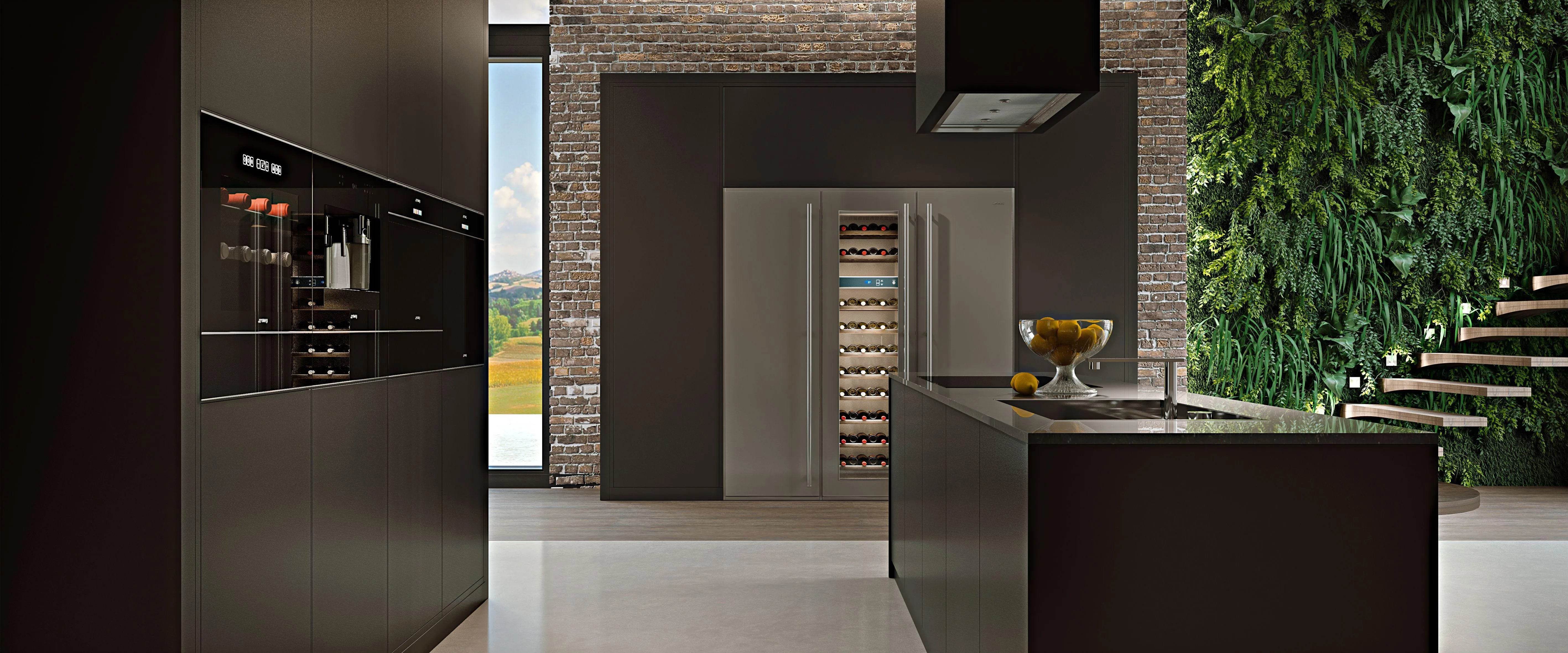Modern kitchen with sleek black cabinets, stainless steel fridge, wine cooler, and green living wall