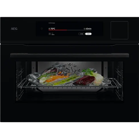 AEG black built-in oven with digital display cooking salmon and vegetables at 70°C for 45 minutes