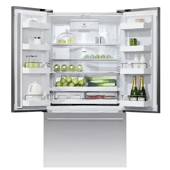 Modern French door refrigerator open, stocked with fresh produce and drinks