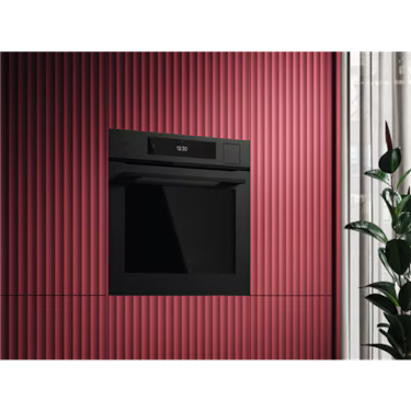 AEG 60cm Steam Oven Matte Black NBP9S83PAT installed in red textured wall.