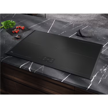 AEG 80cm Induction Cooktop NIH85M30FB installed in a dark marble benchtop.