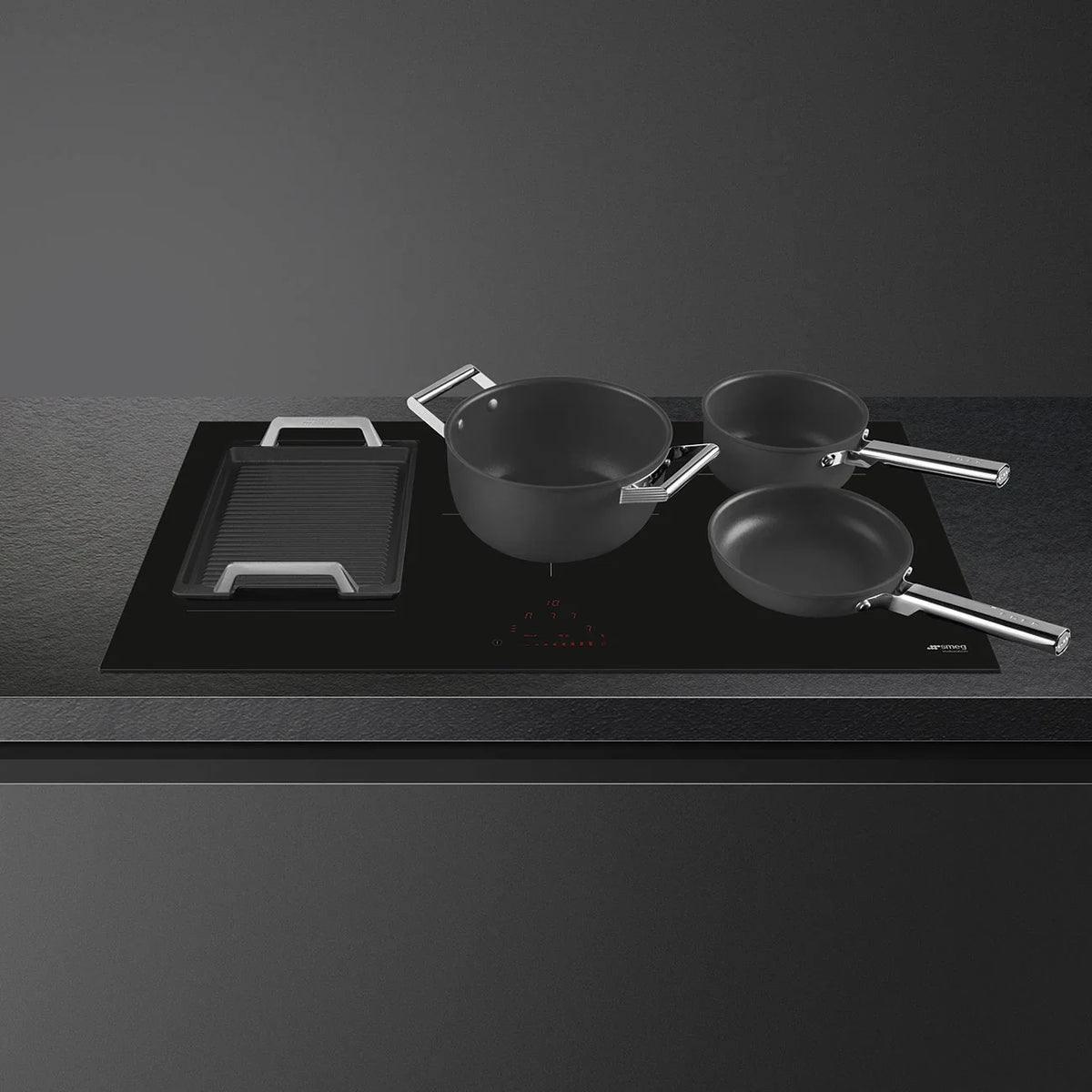 Smeg 90cm Classic 5 Zone Induction Cooktop with black cookware and touch controls
