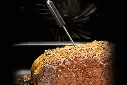 Freshly baked bread with sesame seeds inside oven, golden crust, kitchen appliance