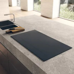 Falcon premium European glass black 1100mm induction cooker on modern kitchen countertop