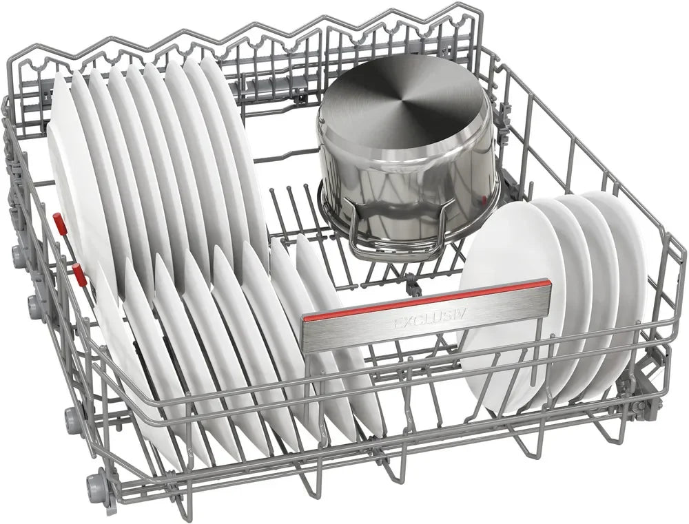 Dishwasher rack with clean white plates and stainless steel pot, showcasing organized kitchen storage