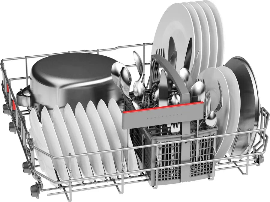 Dishwasher rack loaded with clean plates, bowls, and silverware, showcasing organized kitchen storage