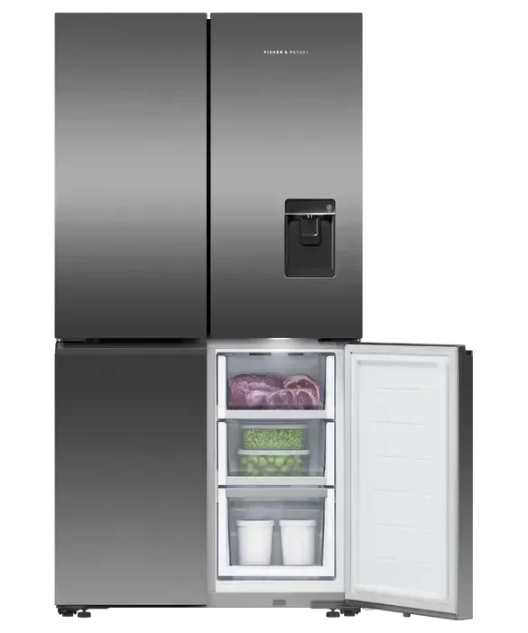 Fisher & Paykel French door refrigerator with open freezer drawer, showcasing organized food storage and water dispenser.