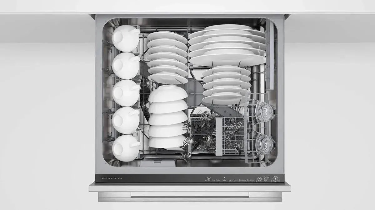 Fisher & Paykel dishwasher loaded with clean white dishes, bowls, and glassware in modern kitchen setting