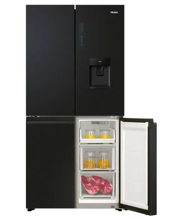 Falcon black upright 1100mm induction cooker with sleek glass finish and open freezer drawer