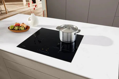 Falcon premium European glass black upright 1100mm induction cooker on white countertop with pot