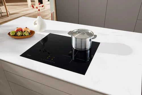 Falcon premium European glass black induction cooker with pot on modern kitchen counter