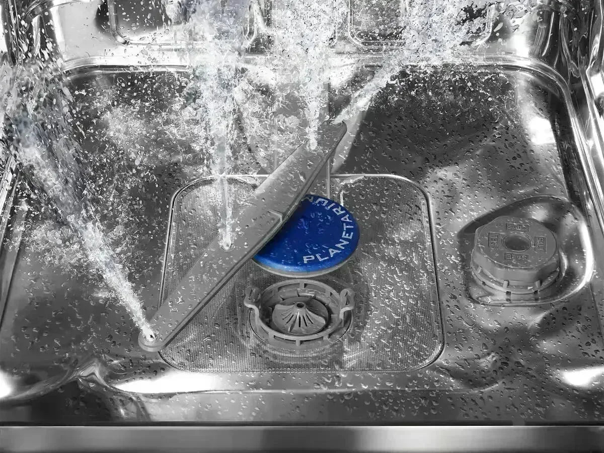 Falcon premium European Glass Black Upright 1100mm Induction Cooker in detail, showing cleaning spray and sleek stainless interior