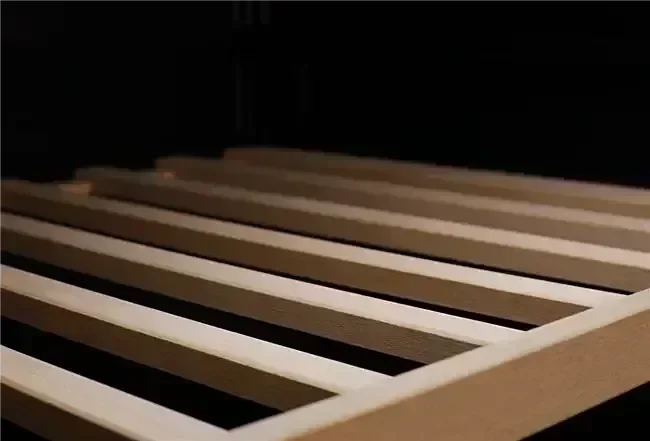 Wooden slatted shelf interior of a modern kitchen appliance storage unit