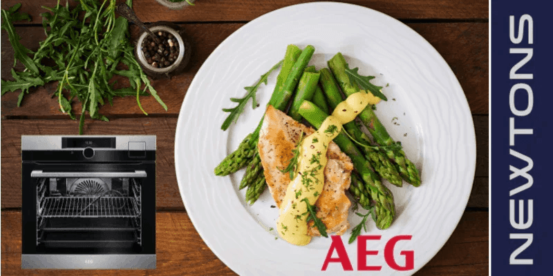 AEG oven with roasted chicken, asparagus, and sauce on white plate, perfect for designer kitchens