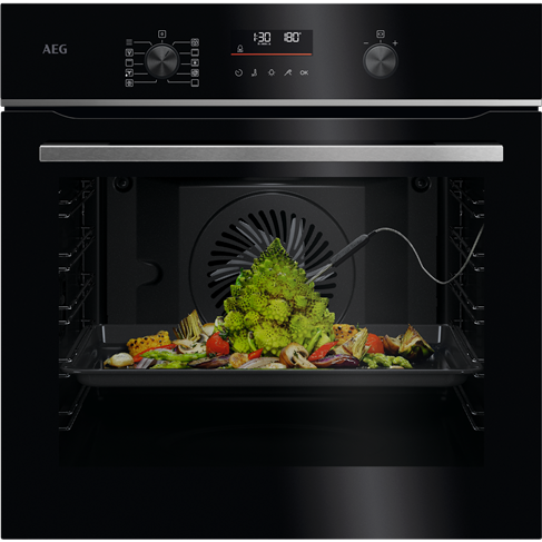 AEG 6000 Series pyrolytic oven roasting a variety of colorful vegetables.
