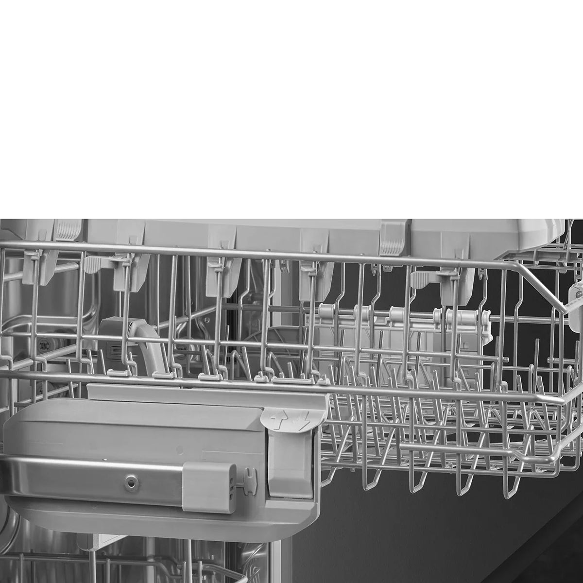Close-up of the stainless steel interior rack of a Smeg semi-integrated dishwasher