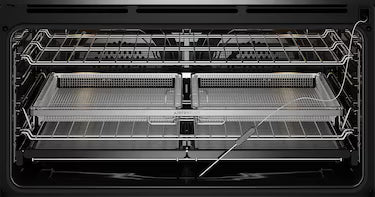 Internal cavity with accessories, air fry trays, racks, food probe of the Electrolux 90cm Pyrolytic Oven EVEP916DSE