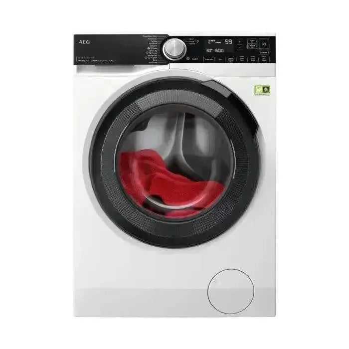 White AEG front load washing machine with red laundry inside, digital display and control panel