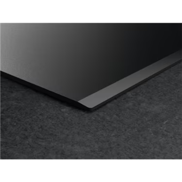 Sleek black glass cooktop with modern edge design for contemporary kitchen appliances