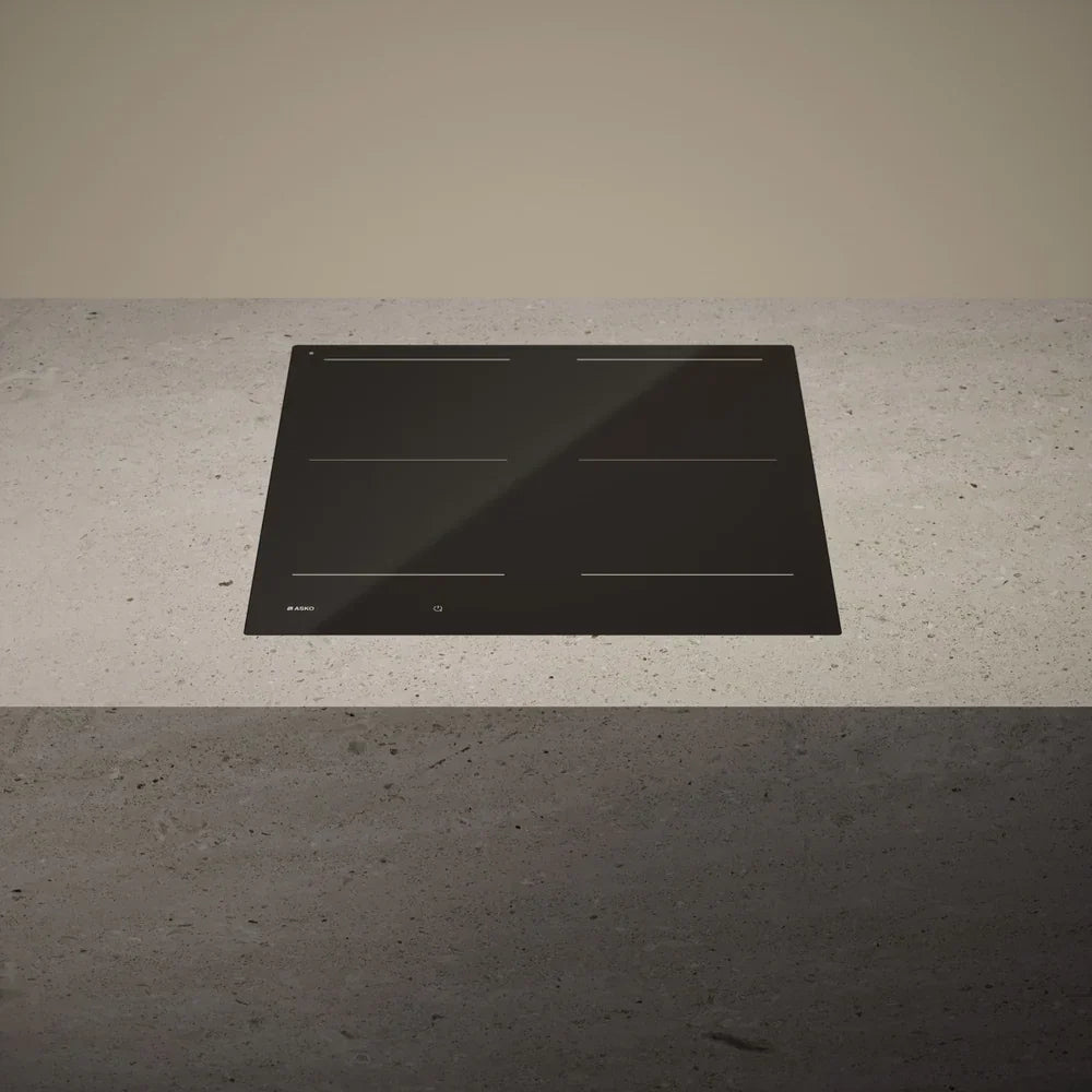 Falcon premium European glass black upright 1100mm induction cooker on concrete countertop