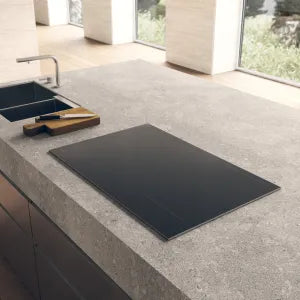 Falcon premium European glass black 1100mm induction cooker on modern kitchen countertop