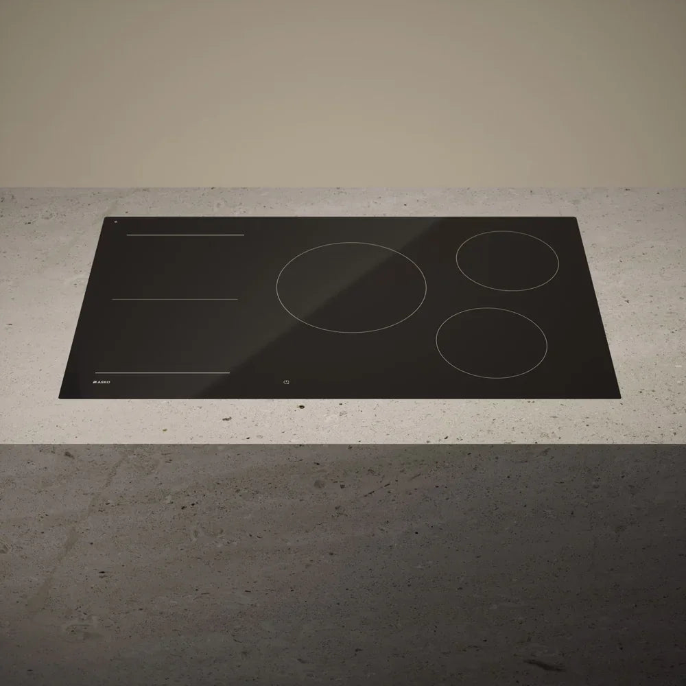 Falcon premium European glass black induction cooker on modern countertop