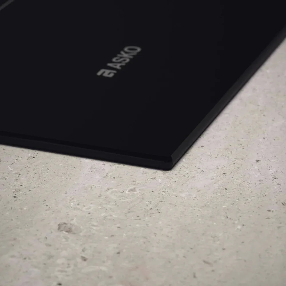 Falcon premium European glass black upright 1100mm induction cooker with ASKO logo on sleek surface