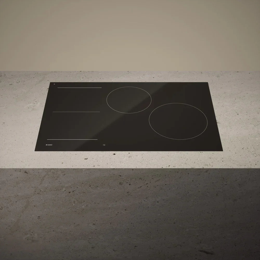 Falcon premium European glass black induction cooker on modern countertop
