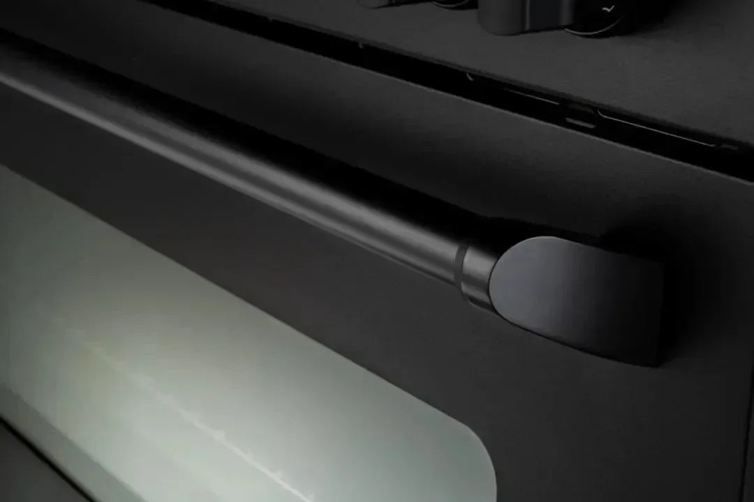 Sleek black oven handle with modern design for designer kitchen appliances
