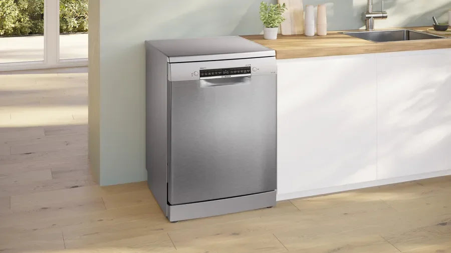 Stainless steel dishwasher in modern kitchen with wooden countertop