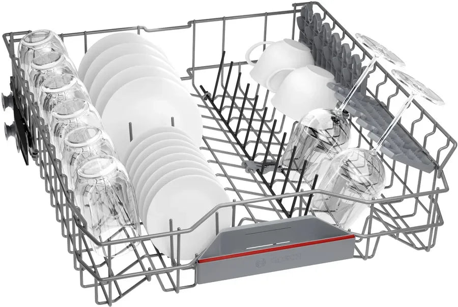Dishwasher rack with plates, glasses, and mugs neatly arranged for efficient cleaning
