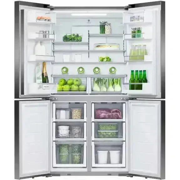 Stainless steel French door refrigerator with open doors, showcasing fresh produce, beverages, and organized storage compartments.