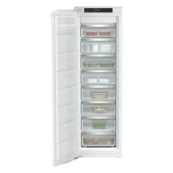 White built-in freezer with open door, multiple transparent drawers, and digital display for modern kitchen storage