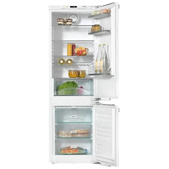 White built-in refrigerator with open doors, showcasing organized shelves, crisper drawers, and food storage compartments.