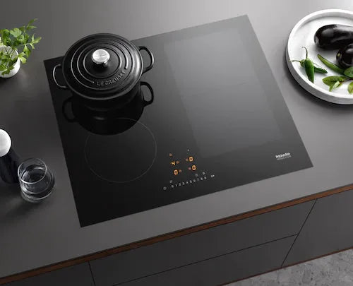 Falcon premium European glass black upright 1100mm induction cooker with digital controls on modern kitchen countertop