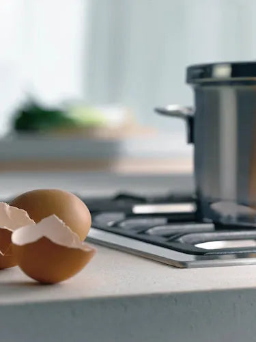 Falcon premium European glass black upright 1100mm induction cooker with eggshells nearby