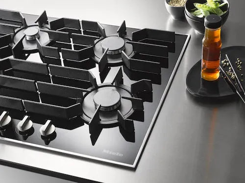 Falcon premium European glass black upright 1100mm induction cooker with sleek design and modern kitchen setup