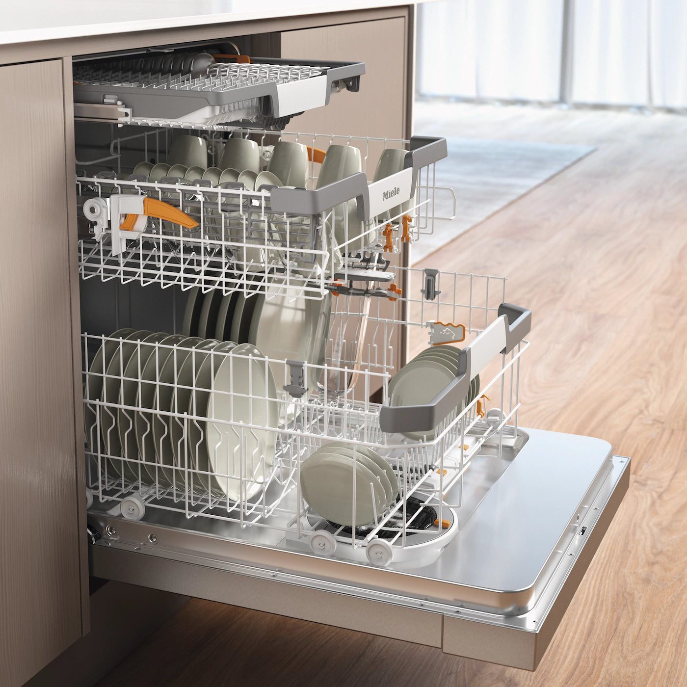 Miele built-in dishwasher with fully loaded racks, sleek stainless steel interior, and adjustable tines for modern kitchen appliance needs