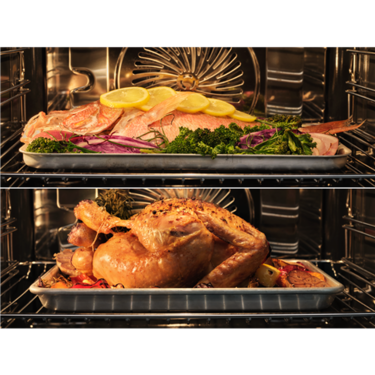 AEG 60cm Steam Oven Matte Black NBB8S731AT internal cavity with a whole roast chicken and fish cooking on separate trays.