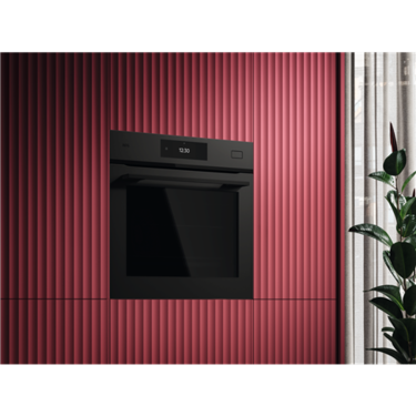 AEG 60cm Steam Oven Matte Black NBB8S731AT installed in a red panelled wall. 