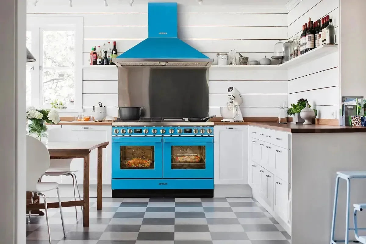 Vibrant blue dual oven range with matching hood in modern kitchen with checkered floor