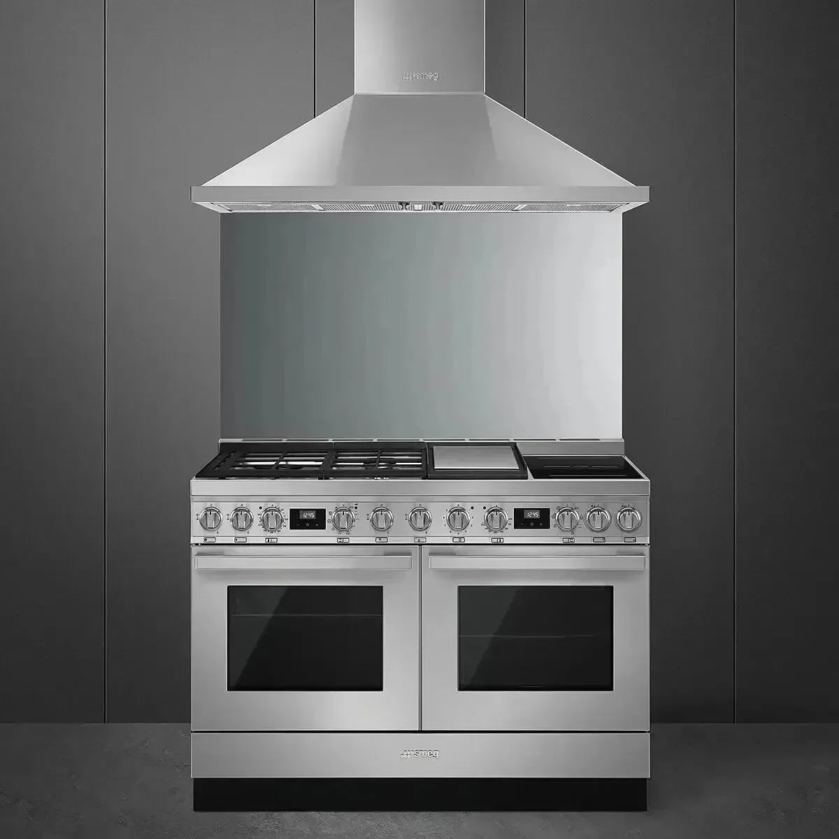 Stainless steel dual oven range with gas cooktop and matching hood for modern kitchen design