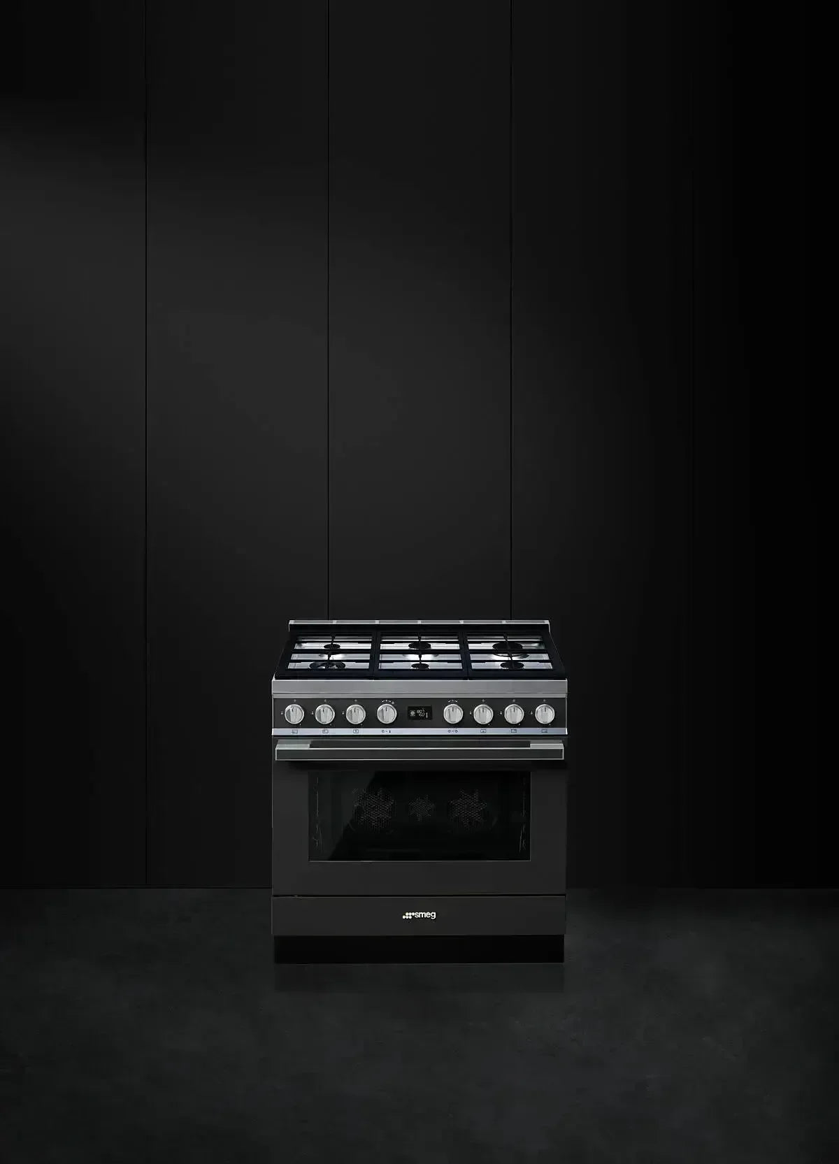 Sleek black Smeg gas range with stainless steel controls, perfect for modern designer kitchens.