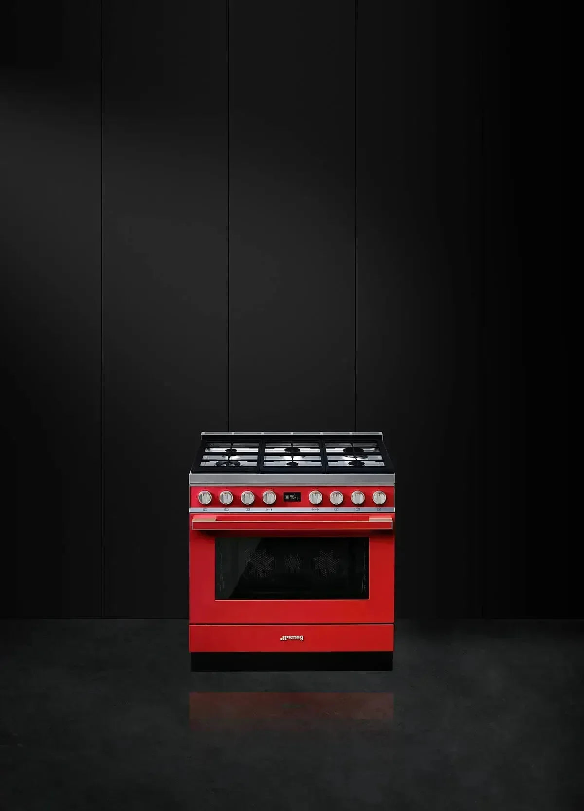 Vibrant red Smeg gas range with stainless steel trim, perfect for modern designer kitchens.