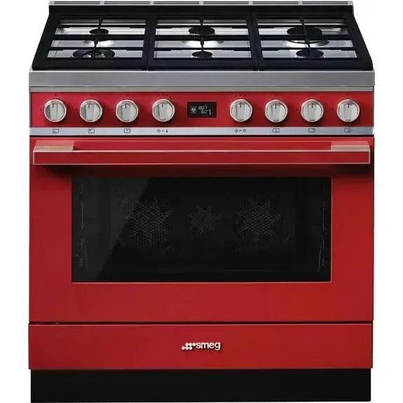 Vibrant red Smeg freestanding gas range with oven, perfect for designer kitchens and home appliance upgrades.