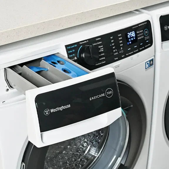 Westinghouse EASYCARE 700 washing machine with open detergent drawer and digital display